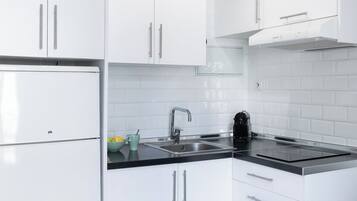 Basic Apartment, 1 Bedroom | Living area | 40-inch flat-screen TV with digital channels, TV