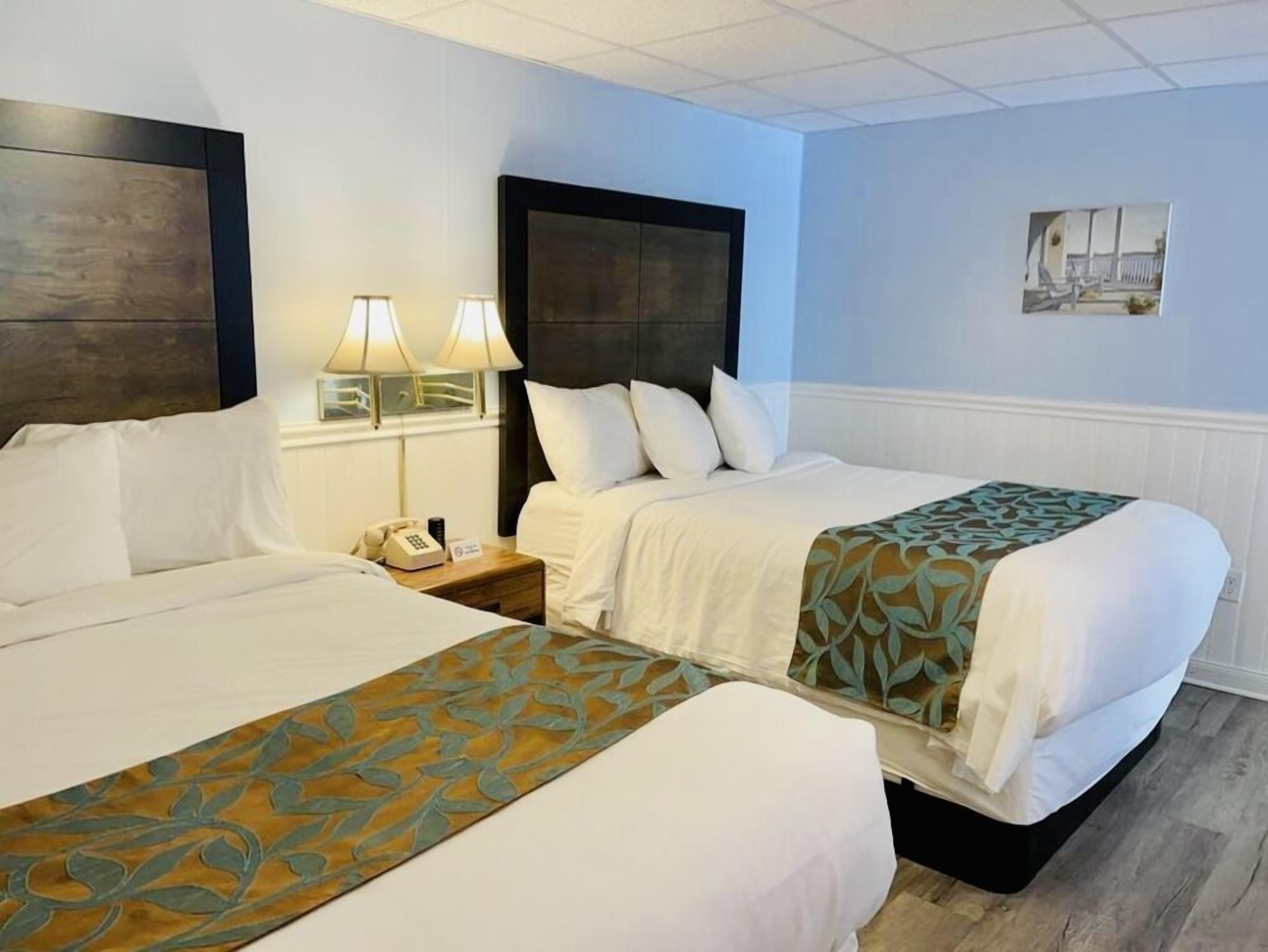 Basic Room, 2 Queen Beds | Desk, WiFi (free), individually furnished, bed sheets