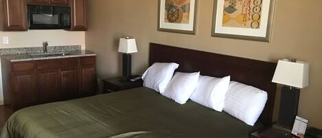 Deluxe Room, 1 King Bed, Kitchenette | Desk, iron/ironing board, free WiFi, bed sheets
