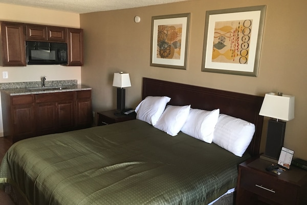 Deluxe Room, 1 King Bed, Kitchenette | Desk, iron/ironing board, free WiFi, bed sheets