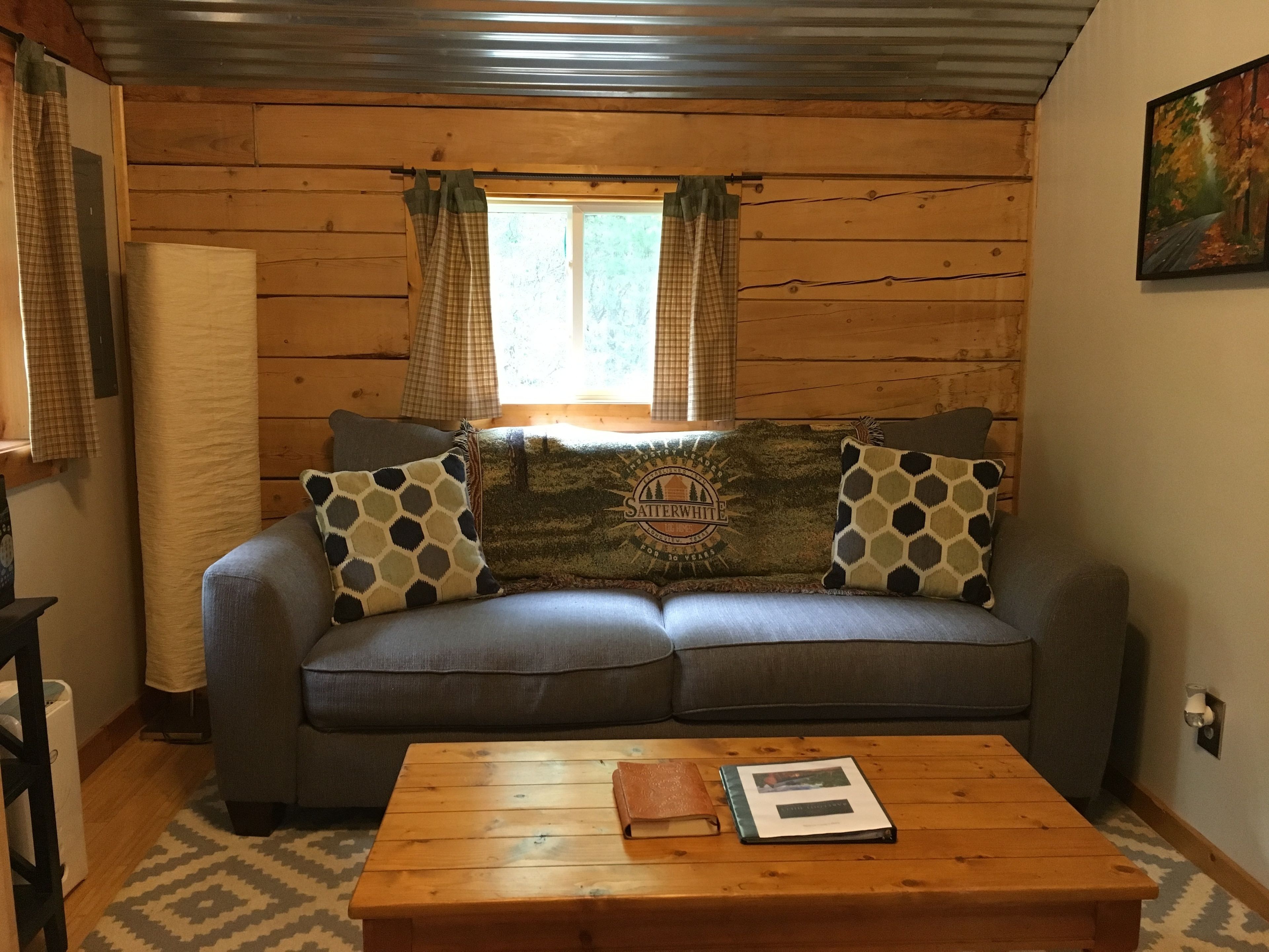 comfort cabin, 1 queen bed with sofa bed, refrigerator & microwave, ground floor | living area | 50-inch smart tv with digital channels, tv, streaming services