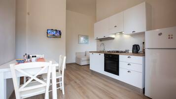 Premium Apartment | Living area | 24-inch LED TV with digital channels, TV