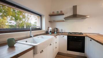 Superior Apartment | Private kitchen | Shared fridge, highchair