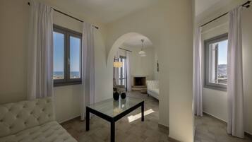 Deluxe Villa, Private Pool, Sea View (Caldera) | Living room | 32-inch flat-screen TV with satellite channels, TV, fireplace
