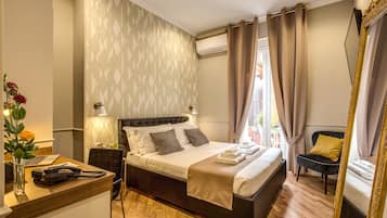 Premium bedding, down comforters, minibar, in-room safe