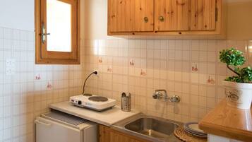 Fridge, electric kettle, cookware/dishes/utensils