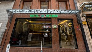 A hotel facade with a prominent sign reading "HOTEL DE MAN". - Hotel Devman (Istanbul)
