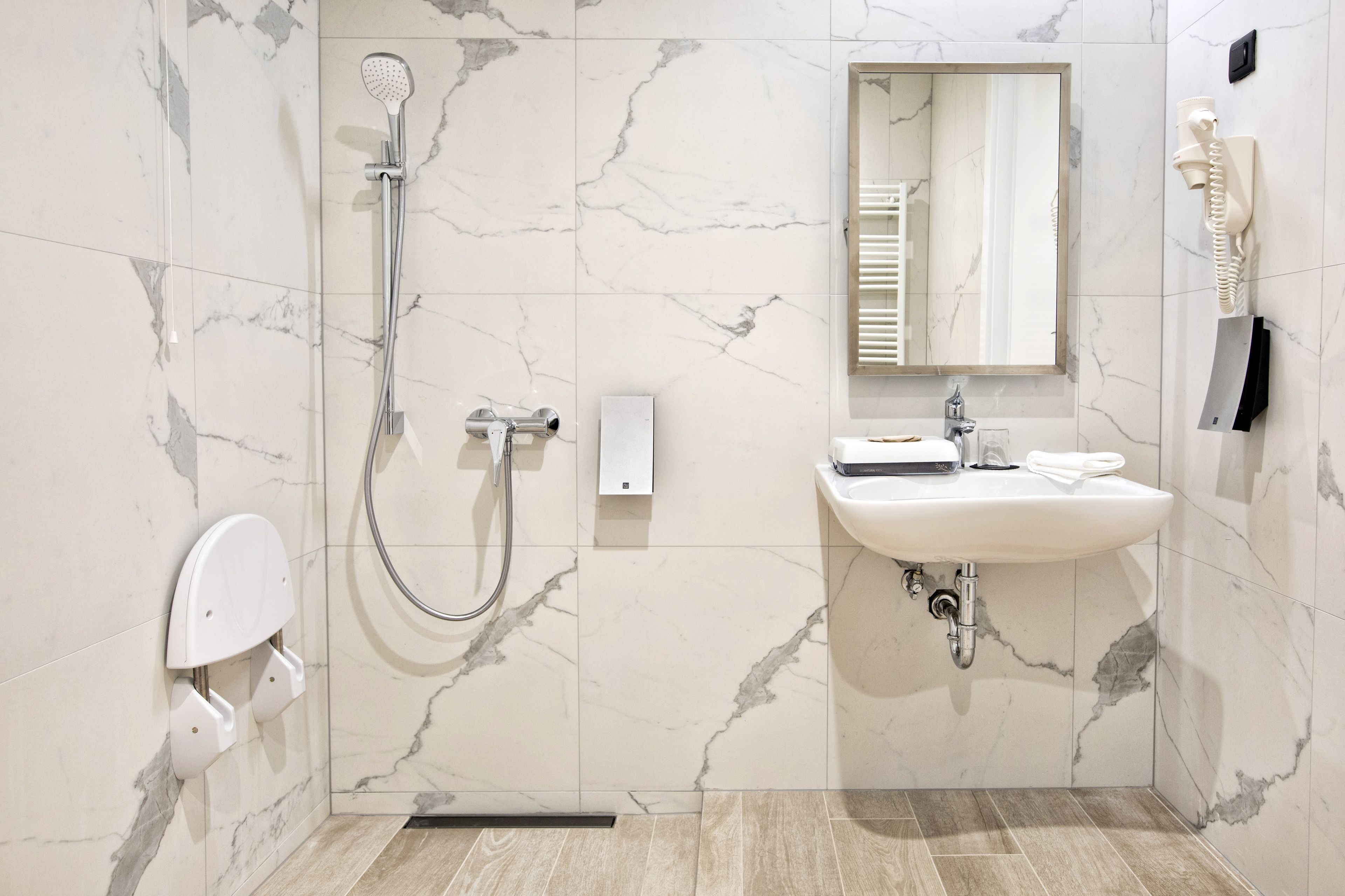 classic single room, accessible, courtyard view | bathroom | eco-friendly toiletries, hair dryer, bathrobes, slippers