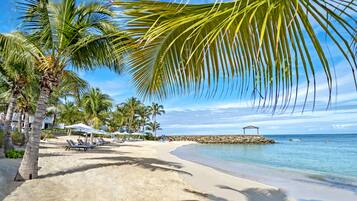 Private beach, white sand, sun-loungers, beach umbrellas