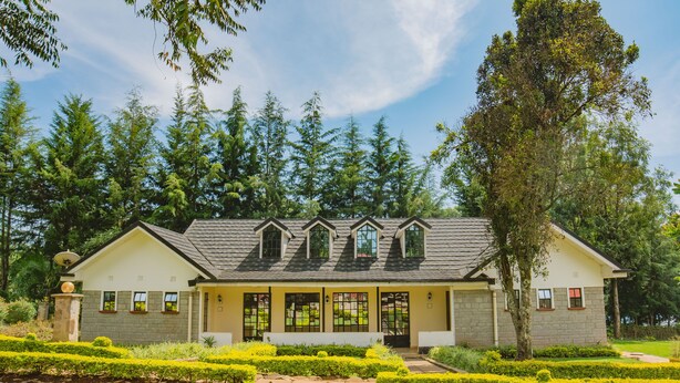 A two-story building with a symmetrical facade, large windows, and a central entrance. - Sahara Gardens Kericho (Kericho)