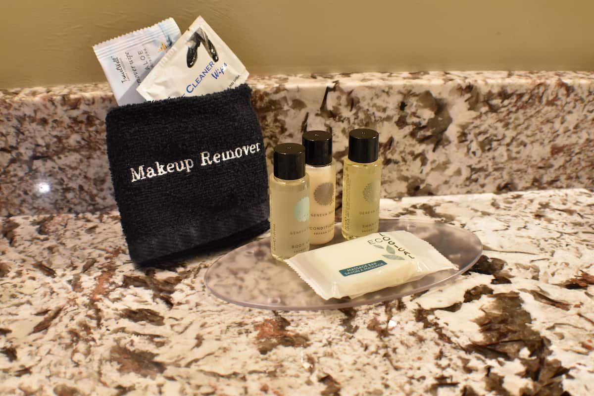 designer toiletries, hair dryer, towels