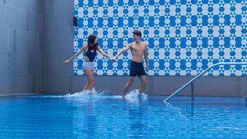 Enjoy a refreshing swim in the pool, surrounded by a unique geometric pattern.