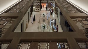 A modern hotel atrium with a central open space, multiple floors, and a decorative ceiling. - Mandarin Oriental, Doha (Doha)