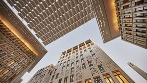 A modern building with a unique geometric facade and multiple windows. - Mandarin Oriental, Doha (Doha)
