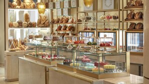A bakery display with various baked goods and pastries. - Mandarin Oriental, Doha (Doha)