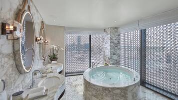 Panoramic Suite, 1 King Bed | Bathroom | Separate tub and shower, rainfall showerhead, eco-friendly toiletries