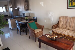 Classic Apartment, 2 Bedrooms | Living area | Flat-screen TV