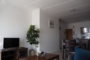 Classic Apartment, 2 Bedrooms | Living area | Flat-screen TV