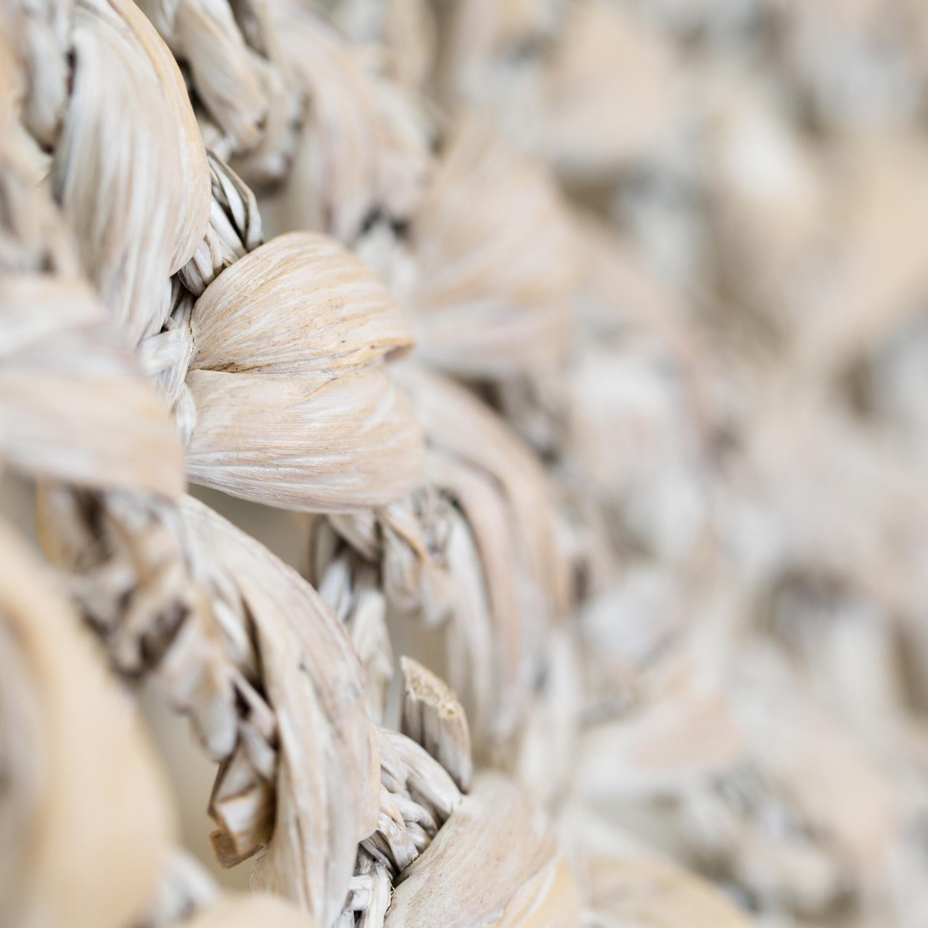 A close-up of a woven textile with a natural, textured pattern.