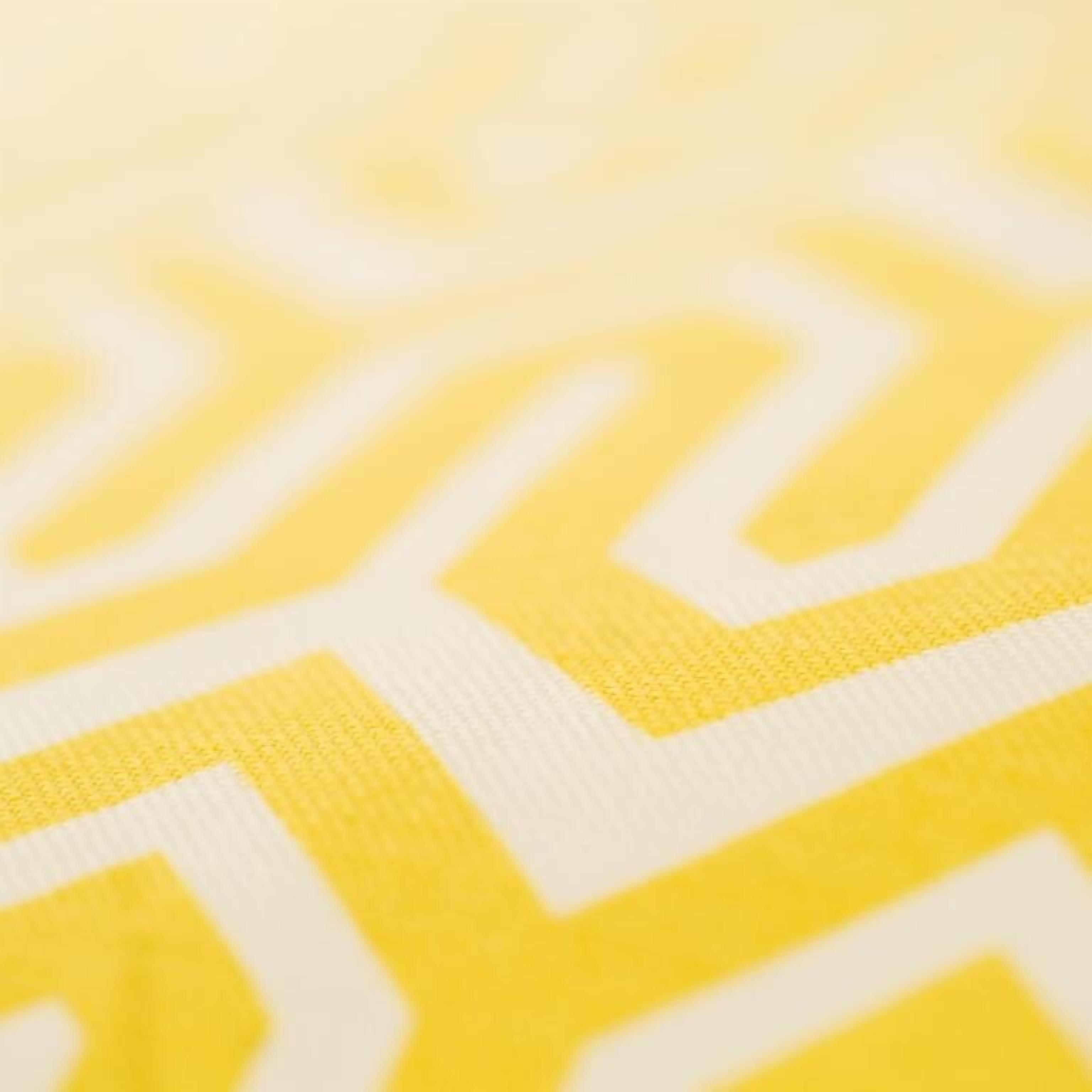 A close-up of a patterned fabric with a geometric design.