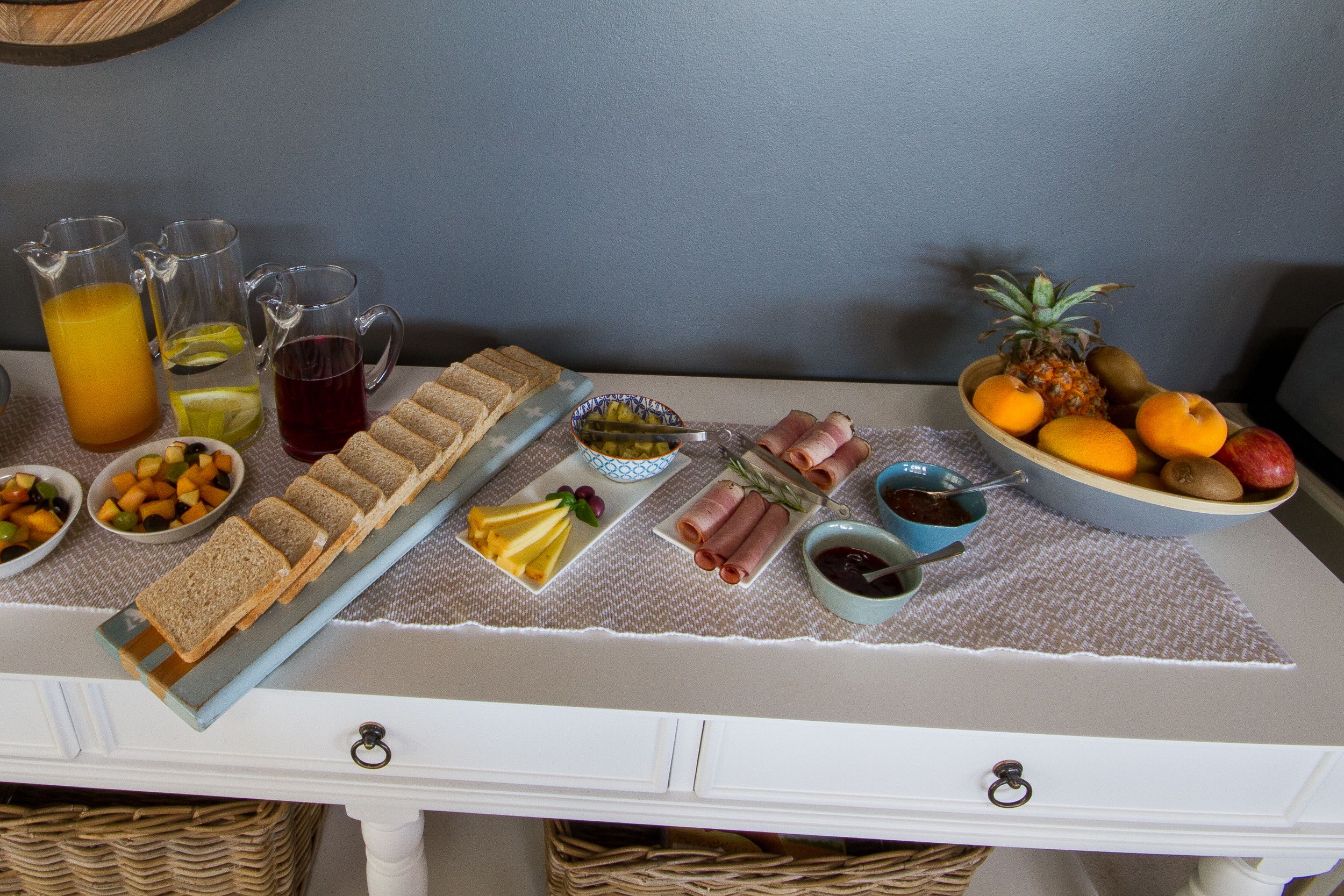 A breakfast buffet with various food items and beverages.