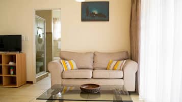 Apartamento Premium, 1 habitación | Zona de estar | Una televisión LCD