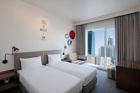 In-room safe, desk, blackout drapes, soundproofing. Rove Trade Centre