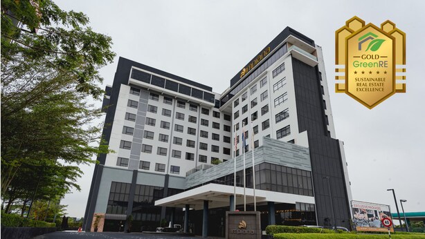 A modern hotel with a prominent entrance, a covered area, and a sign indicating "Exclusive Packages". - Impiana Hotel Senai (Senai)