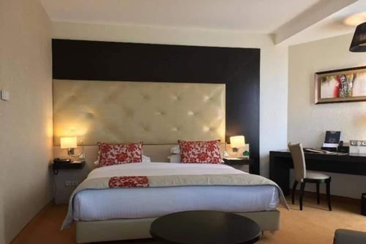 Deluxe Room | Minibar (some free items), in-room safe, desk, blackout drapes