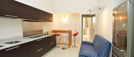 Appartement Deluxe | Aire de séjour | Téléviseur à écran plat