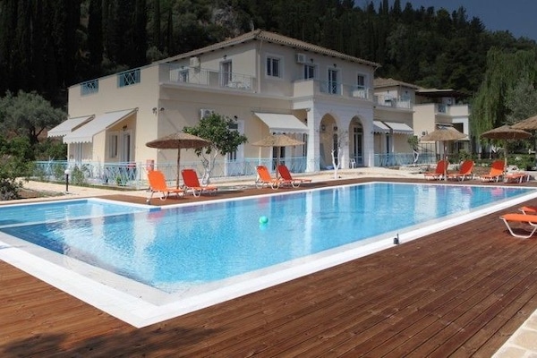 Seasonal outdoor pool, pool umbrellas, pool loungers