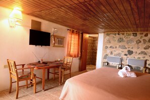 Standard Room, 1 King Bed, Non Smoking (Rock Walled Room) | Desk, free WiFi, bed sheets