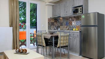 Apartment, 1 Bedroom | Private kitchen | Fridge, microwave, stovetop, coffee/tea maker