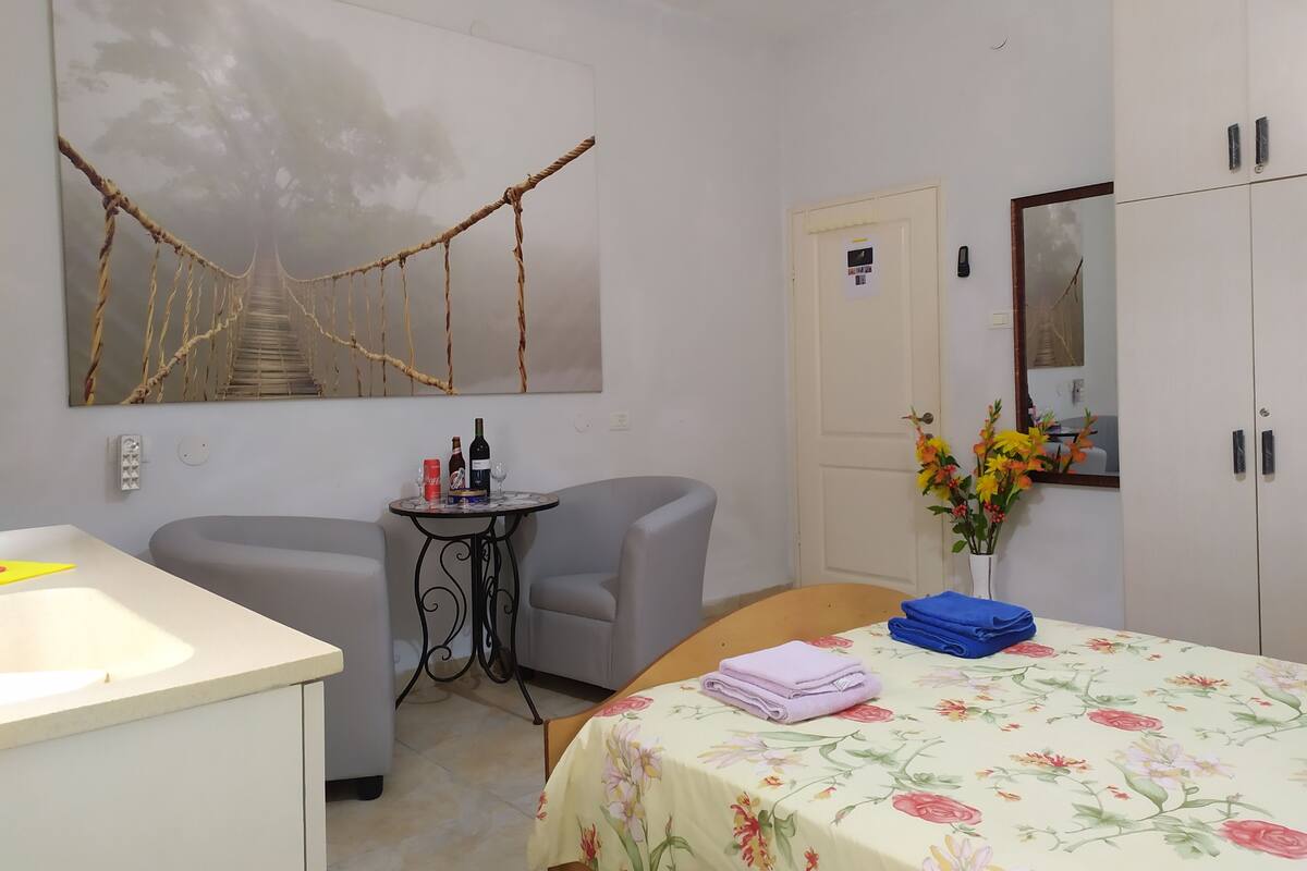 Apartment, 1 Bedroom | Desk, laptop workspace, iron/ironing board, rollaway beds
