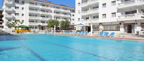 Seasonal outdoor pool, open 9:00 AM to 9:00 PM, pool umbrellas