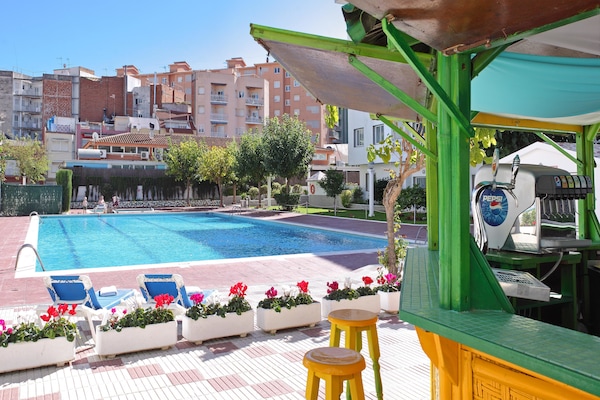 Seasonal outdoor pool, open 9:00 AM to 9:00 PM, pool umbrellas