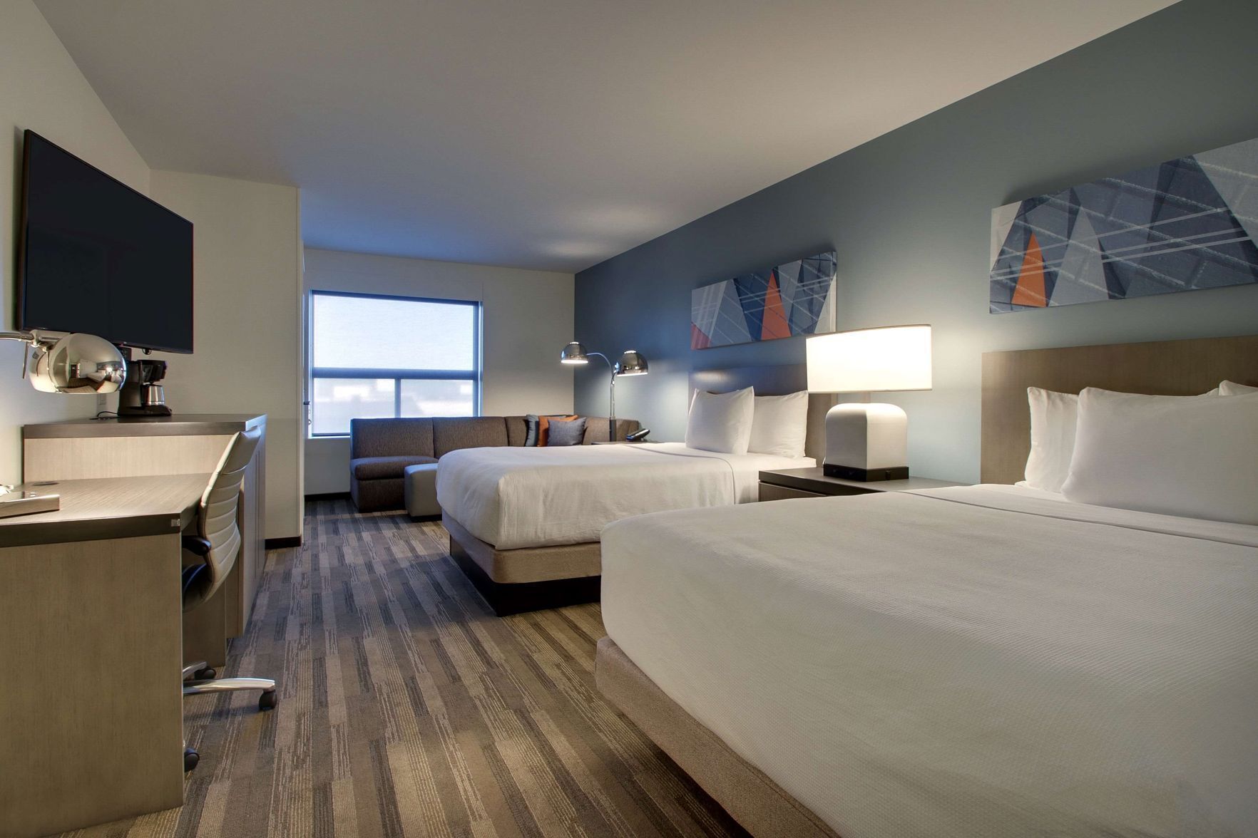 Hypo-allergenic bedding, desk, laptop workspace, blackout curtains