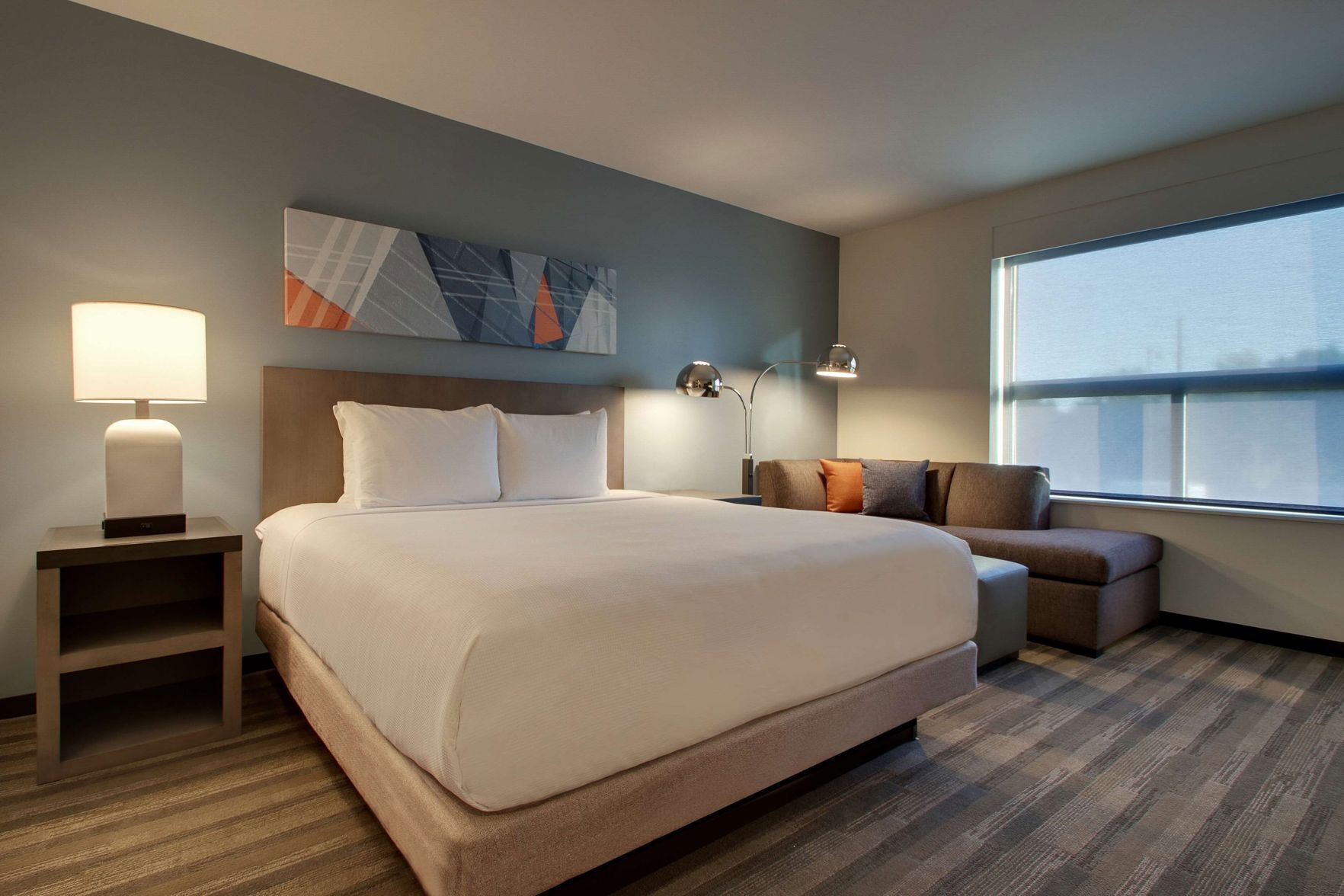 Hypo-allergenic bedding, desk, laptop workspace, blackout curtains
