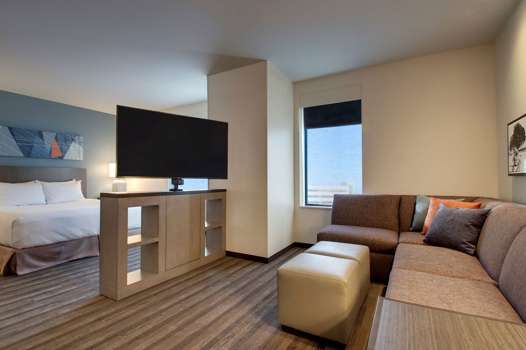 Hypo-allergenic bedding, desk, laptop workspace, blackout curtains