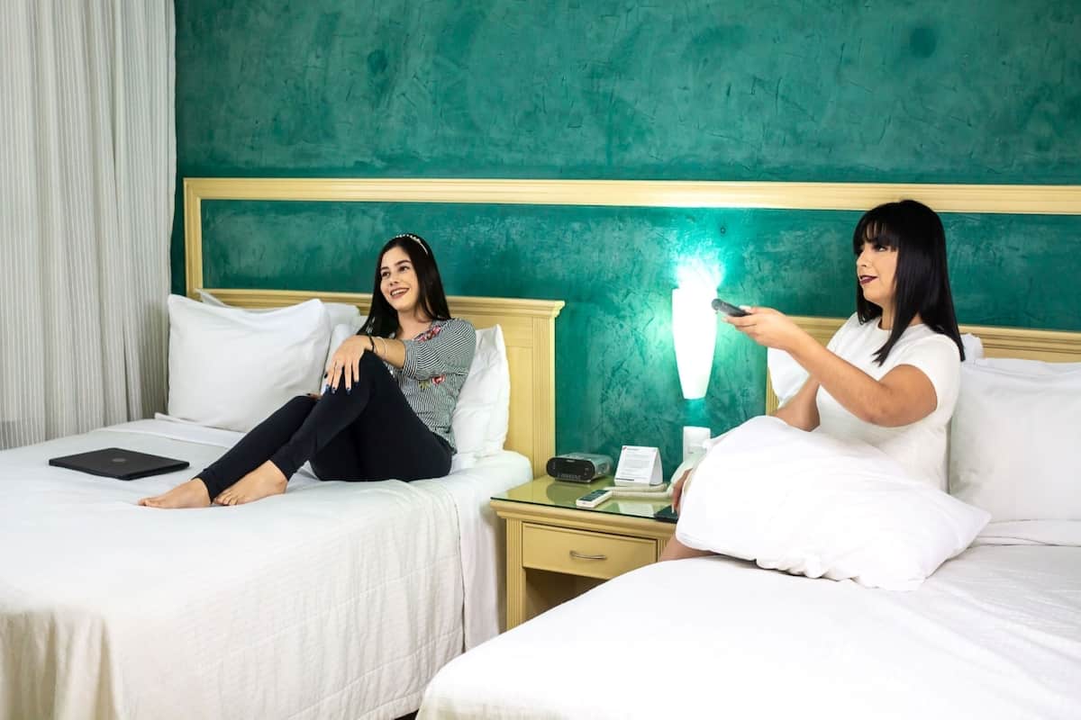 Standard Double Room, 2 Queen Beds | In-room safe, desk, laptop workspace, blackout drapes