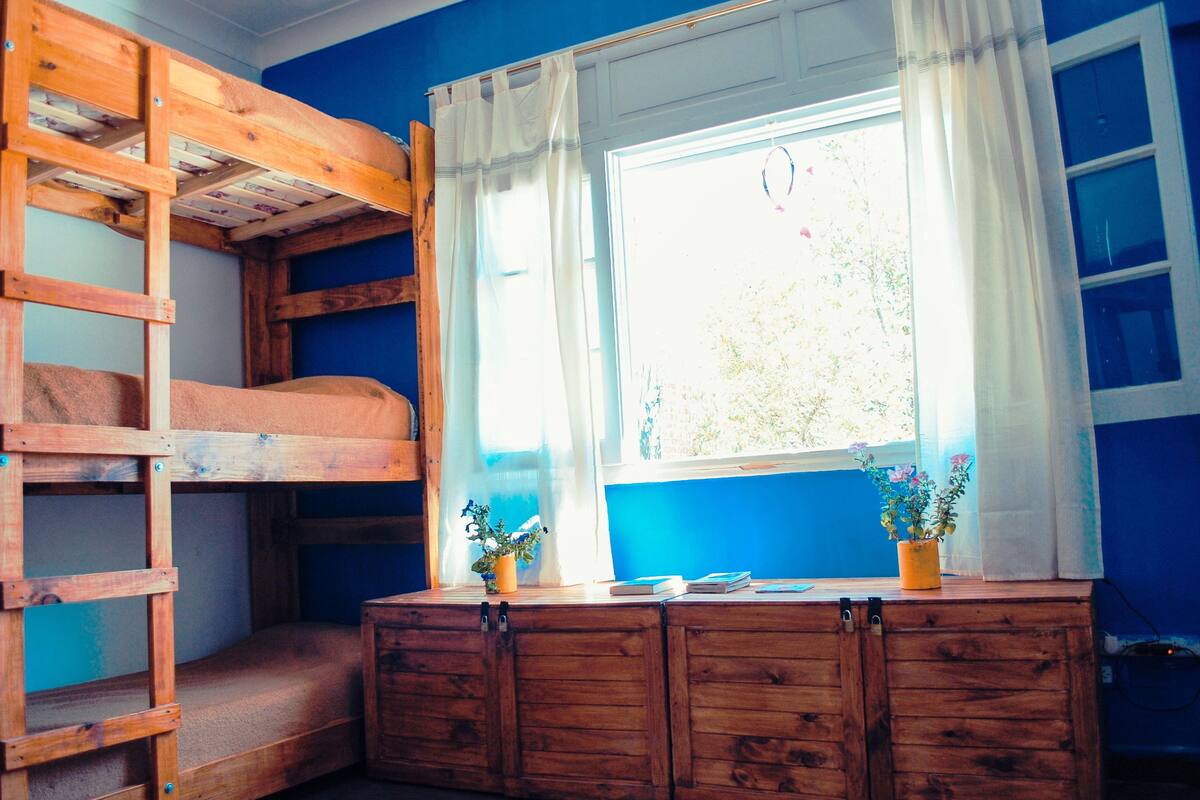 Individually decorated, individually furnished, desk, rollaway beds