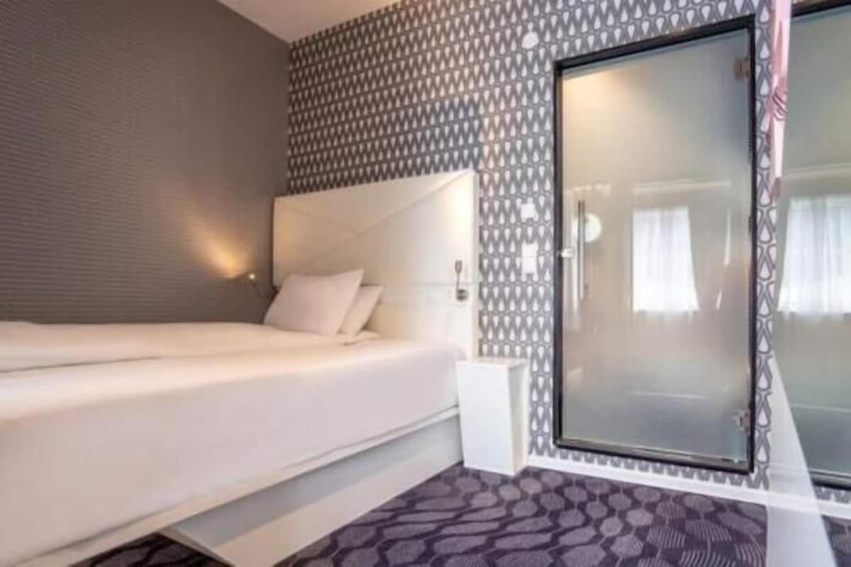 Premium bedding, pillow-top beds, blackout curtains, iron/ironing board