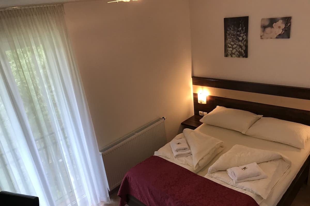 Economy Double Room, 1 Queen Bed, Refrigerator | 1 bedroom, desk, laptop workspace, soundproofing
