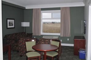 Executive Suite, 1 King Bed, Kitchenette | Living room | 42-inch LCD TV with digital channels, TV - Nova Inn Wabasca (Wabasca-Desmarais)