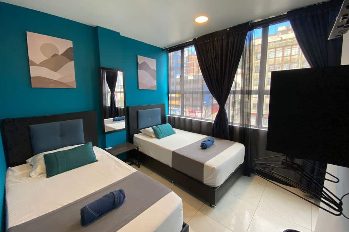 Twin Room | Down comforters, laptop workspace, iron/ironing board, free WiFi