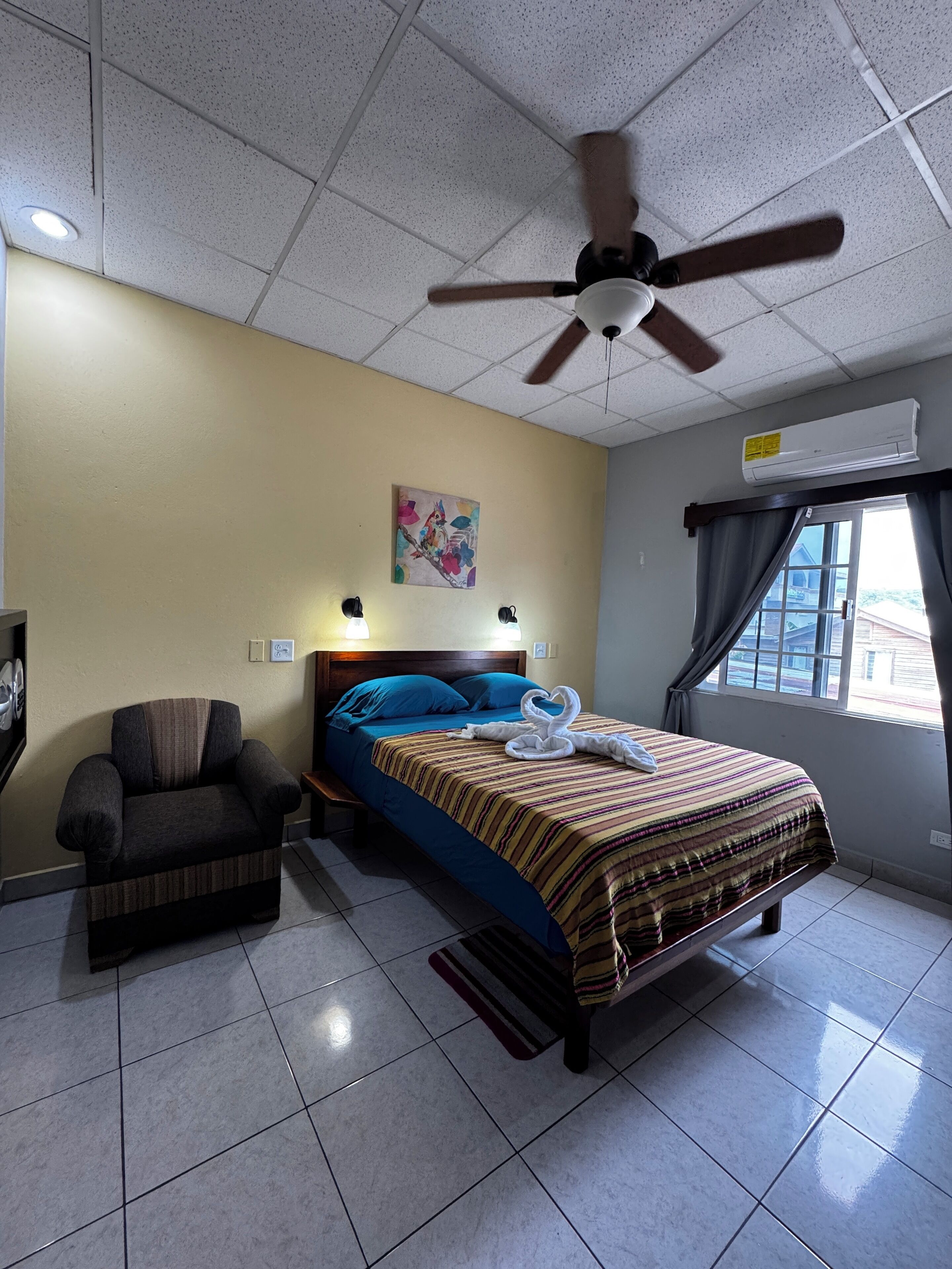 deluxe room, 1 queen bed, private bathroom | 1 bedroom, individually furnished, laptop workspace, blackout curtains