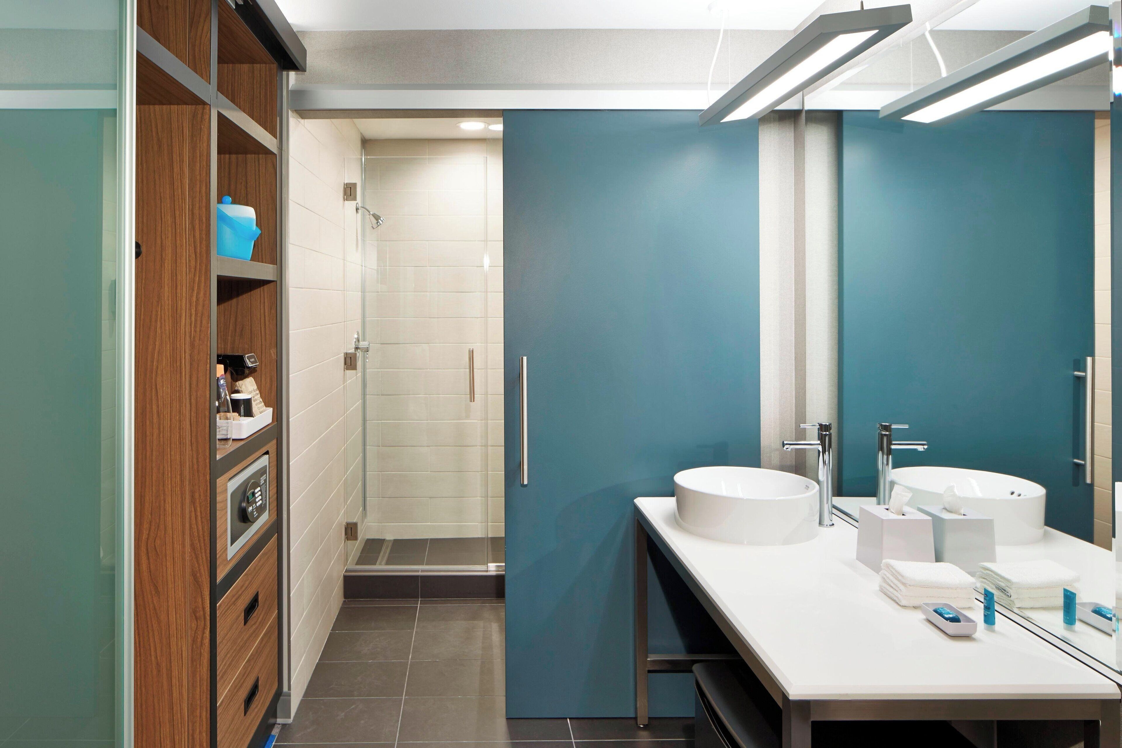 rainfall showerhead, designer toiletries, hair dryer, bathrobes