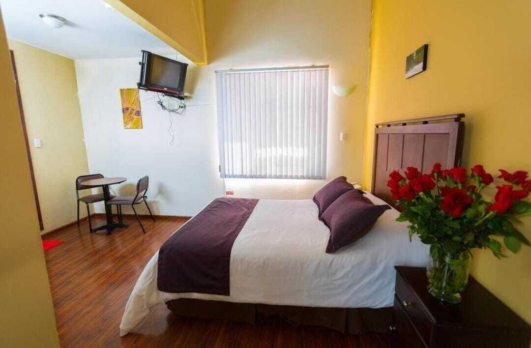 Minibar, desk, laptop workspace, iron/ironing board