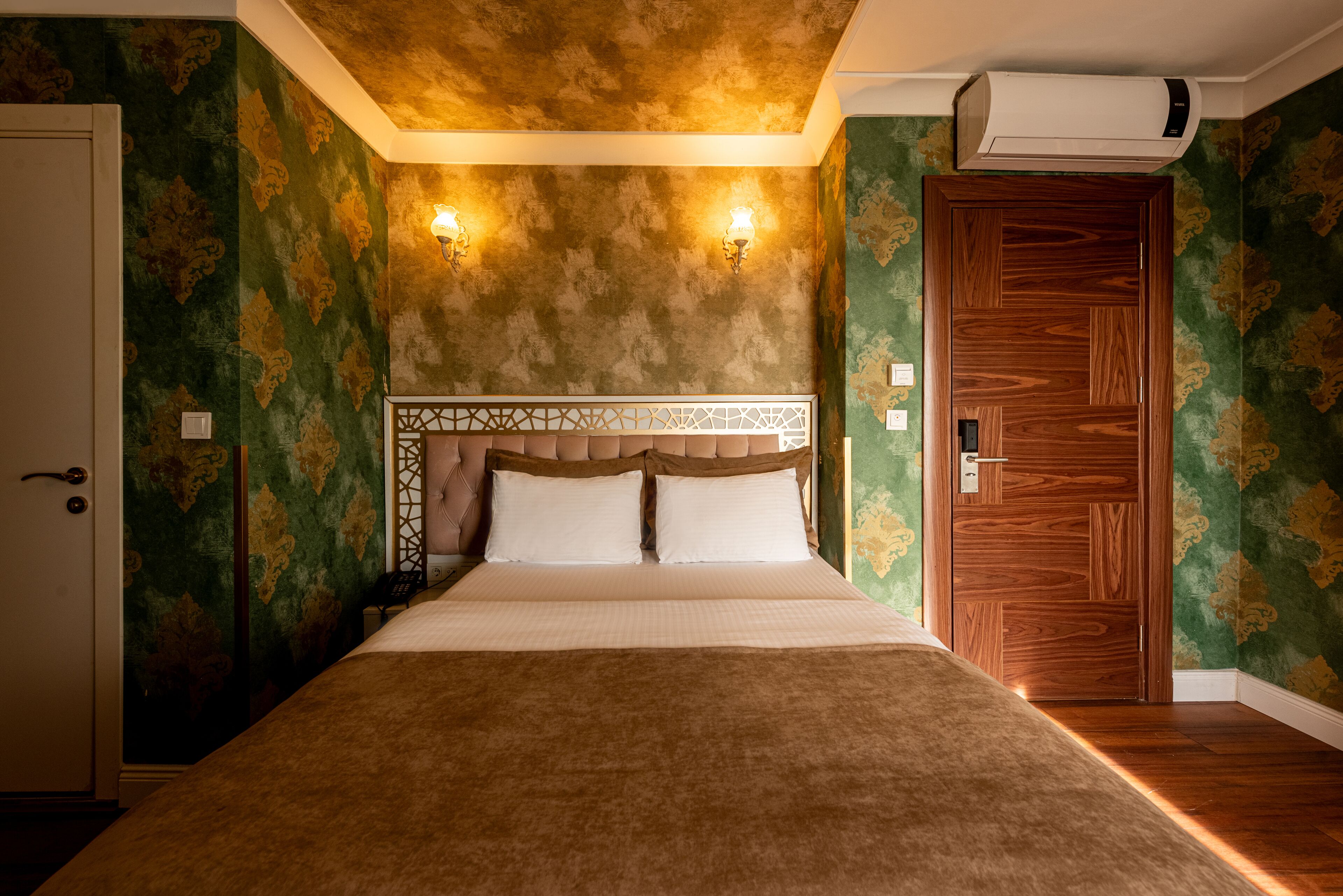 family triple room, city view | down duvets, select comfort beds, minibar, desk