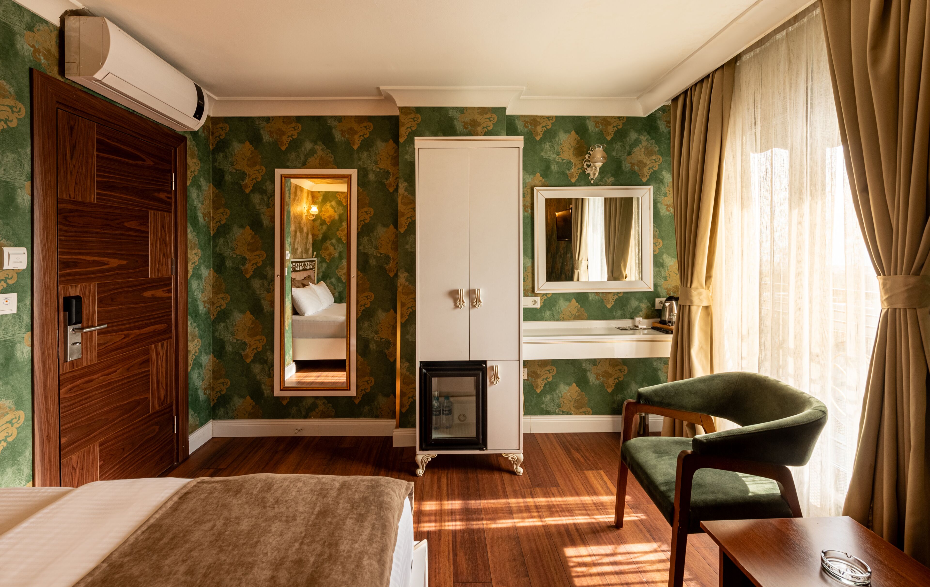 family triple room, city view | down duvets, select comfort beds, minibar, desk